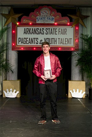 NE Region winner: Prestin Garey, 14, of Drasco, played the guitar and harmonica to "heart of Gold."